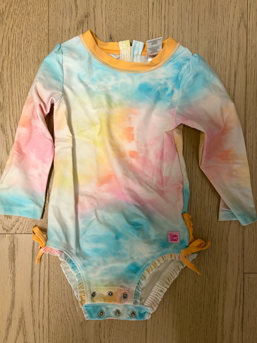Ruffle Butts Pastel Tie-Dye Rash Guard with Peach Trim